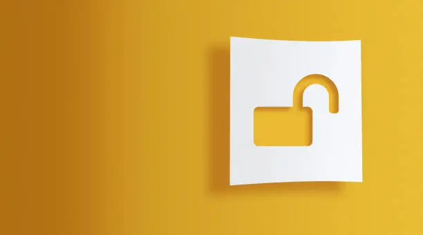 Photo of unlock sign on white information paper on yellow background