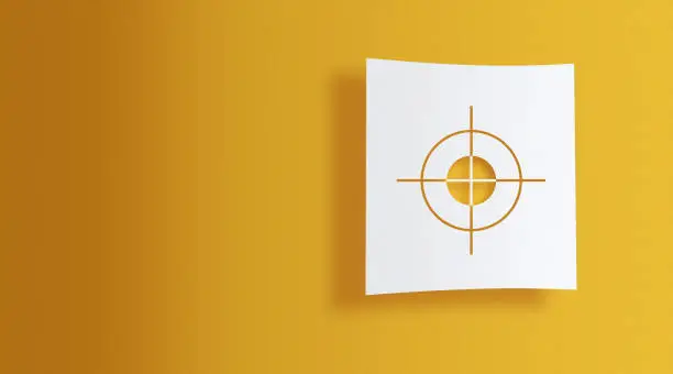 Photo of target sign on white information paper on yellow background