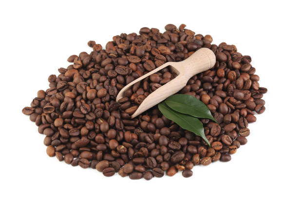 istock Coffee beans with scoop isolated on white background 1143930647