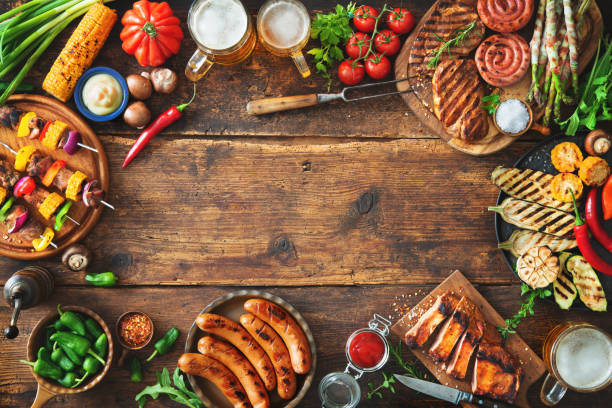istock Grilled meat and vegetables on rustic wooden table 1143931767