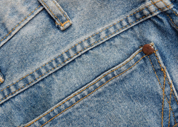 istock Seam pattern of old blue jeans background. Denim backdrop. 1143933366