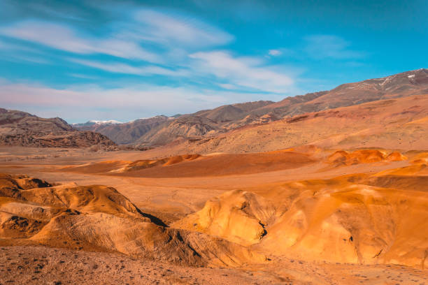 istock Yellow and red rocks under blue sky. Desert landscape with mountains. 1143933430