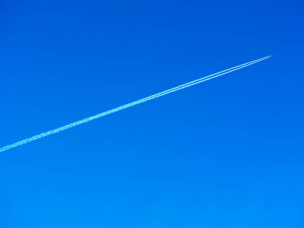 istock Diagonal trace from jet airplane in the clear sky background 1143934366