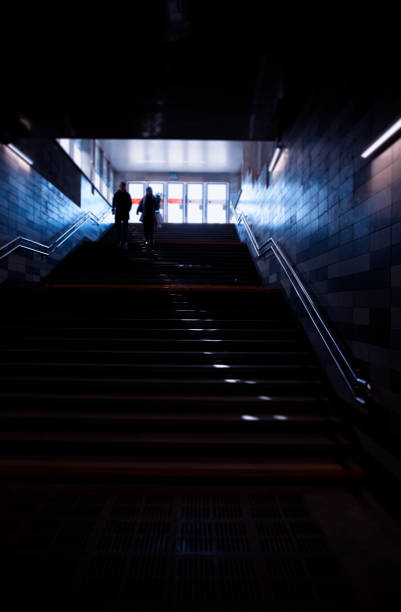 istock Vertical metro stairs with dramatic light leak city background 1143934396