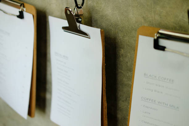 istock blank white paper poster menu hanging on wall 1143936015