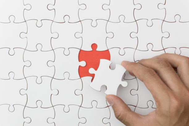 istock unfinished jigsaw puzzle texture on red background. connection concept. idea concept.association concept 1143936114