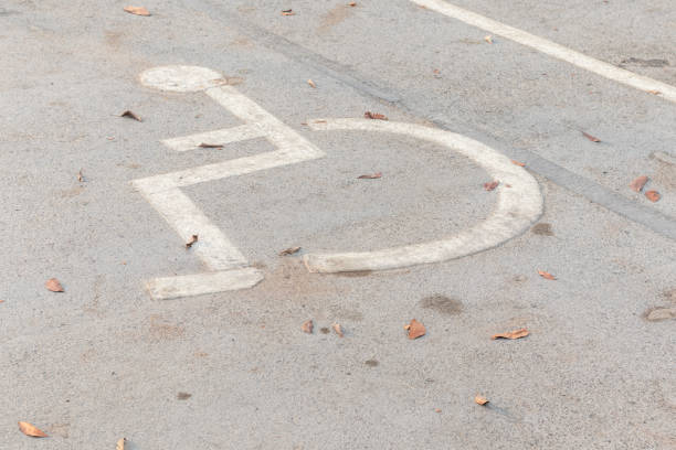 istock disable people sign at parking lot in Thailand 1143937548