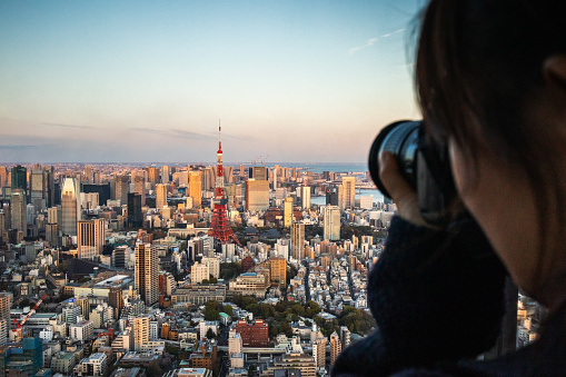 people taking photo of tokyo skyline