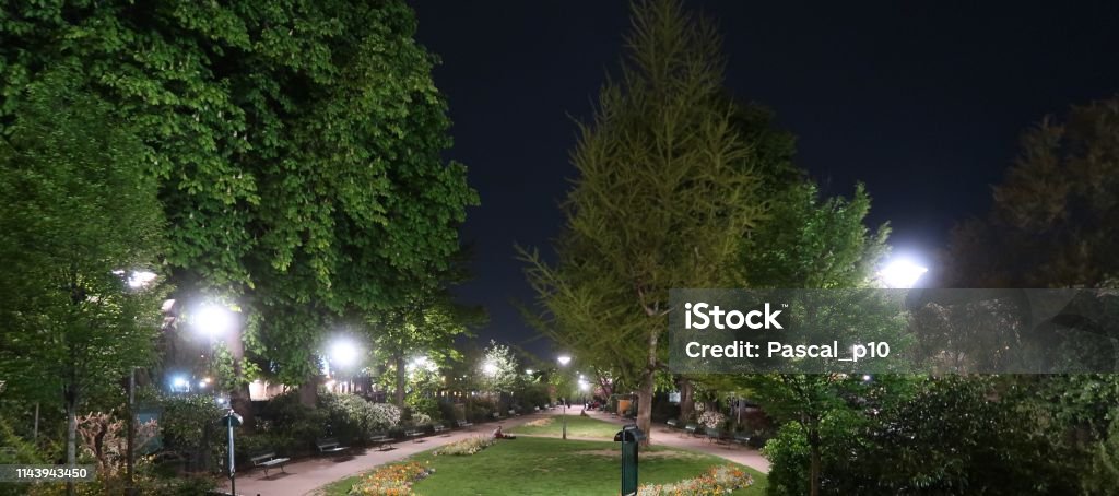 Public park by night Paris, France – April 17, 2019: photography showing a public park by night 2019 Stock Photo