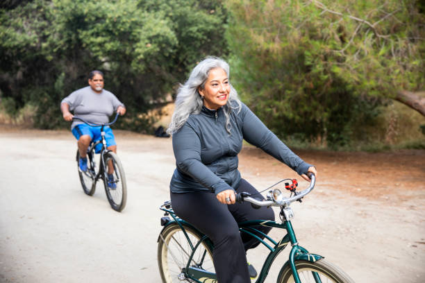 istock Senior Mexican Couple Riding Bikes 1143943973