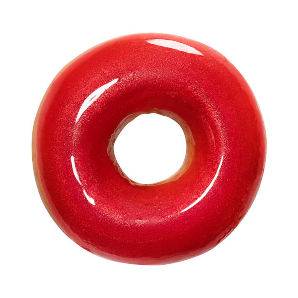 Donut with red glossy glaze isolated on white background. One round red Doughnut. Front view. Top view stock photo