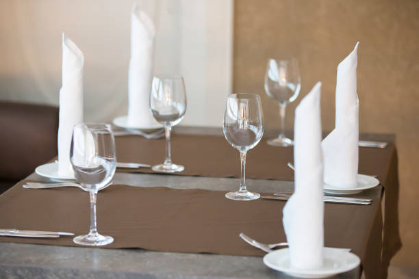 istock Table in a restaurant with empty glasses and plates. 1143946857