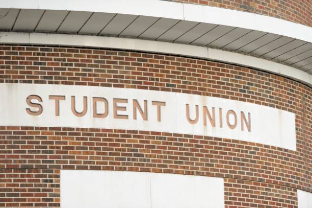 istock Student Union sign on curved wall 1143947530