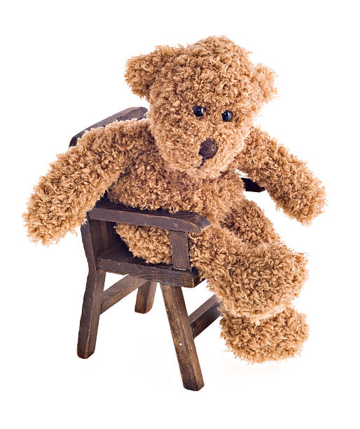 istock Teddy Bear Jiving in his Chair 114395030