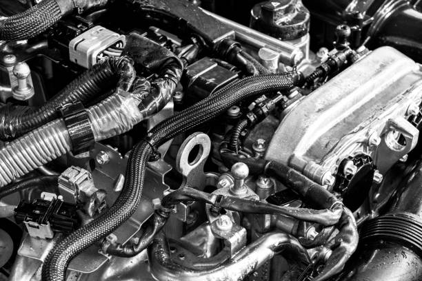istock Car engine. Car engine part. Close-up image of an internal combustion engine. Engine detailing in a new car. Car detailing. Black and white 1143951098