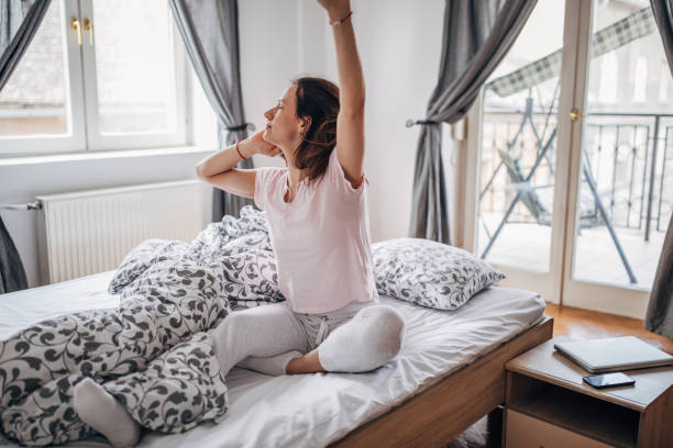 istock Woman stretching after waking up 1143952138