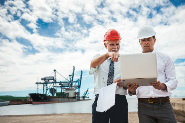 istock Inspectors At Commercial Dock 1143957098