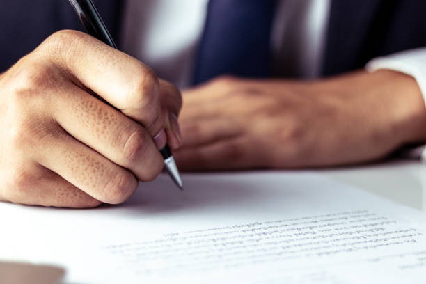 istock Businessman signing a document in office 1143958732