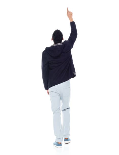 istock Handsome African American male standing on white background - pointing up 1143961709