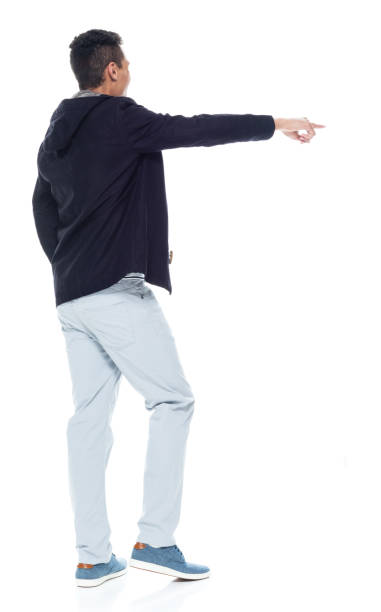 istock Handsome African American male standing on white background - pointing 1143961852