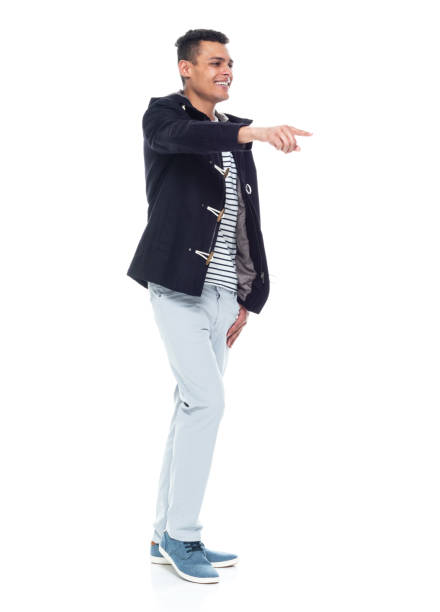 Handsome African American male standing on white background - pointing