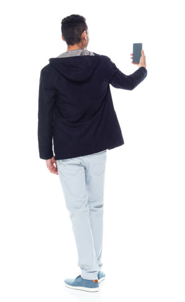 istock Handsome African American male standing on white background - taking a selfie 1143961978