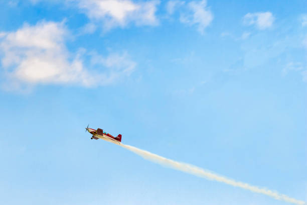 Concept of sucses Concept of sucsess and freedom. Small red airplane rises in a blue sky. No roads, no limits. words in the sky stock pictures, royalty-free photos & images