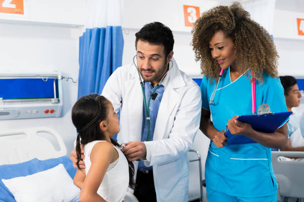 istock Doctor examining a girl 1143964608