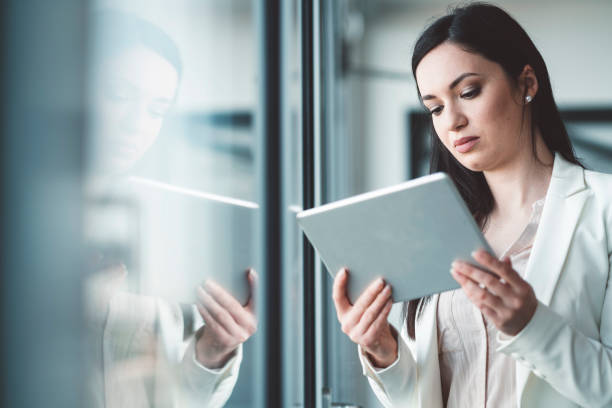 istock Beautiful young businesswoman absorbed in work 1143967049