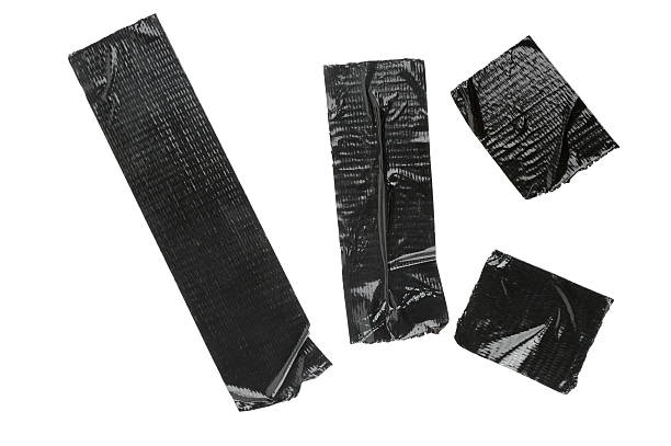Pieces Of Black Duct Tape Isolated On White  adhesive tape stock pictures, royalty-free photos & images