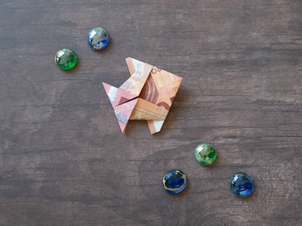 istock Single money origami fish 1143970248