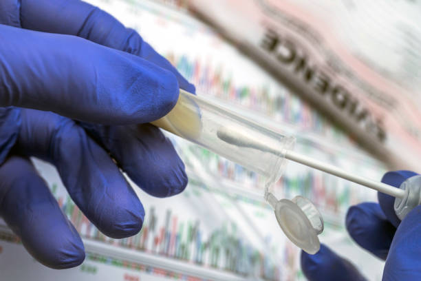 Expert police examines semen for DNA evidence, conceptual image stock photo