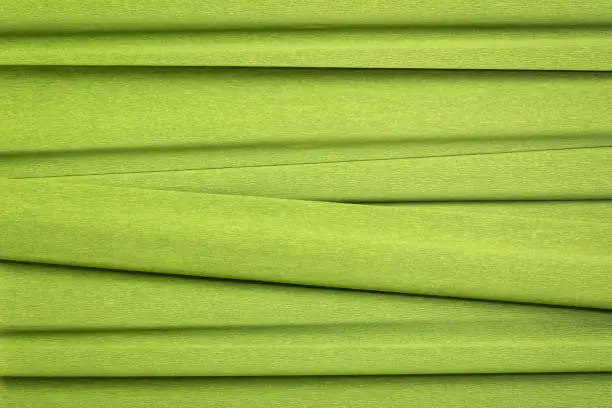 green crepe paper - background with crinkled texture