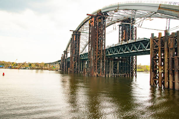 istock Bridge under construction across the Dnieper River in Kiev Ukraine 1143973040