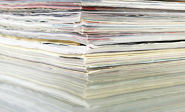 istock Pile Of Magazines With Reflection On Glass 114397352