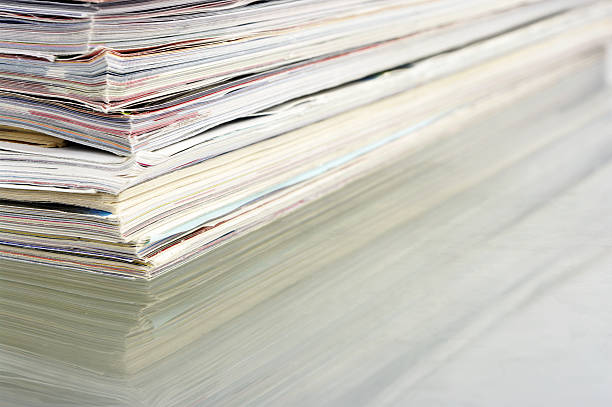 istock Pile Of Magazines With Reflection On Glass 114397375