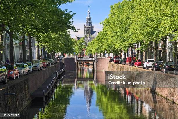 View On The Tower Of Sint Janskerk From Bridge Across The Gouwe River In Gouda Netherlands Stock Photo - Download Image Now