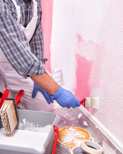 istock House painter worker at work in the construction site. Building. 1143974723