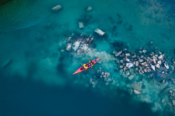 istock two athletic man floats on a red boat in river 1143974922