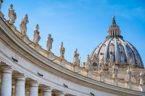 The imposing colonnade by Bernini and the dome of St. Peter's Basilica in the historic heart of Rome stock photo