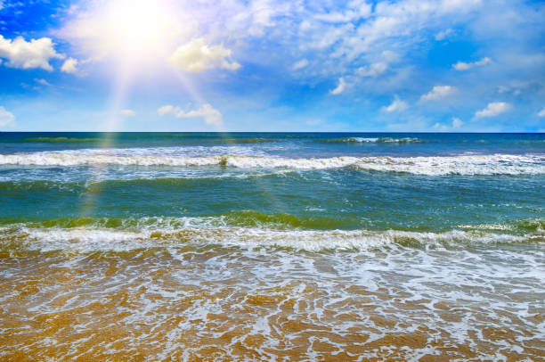 Beautiful seascape and sun on blue sky background.