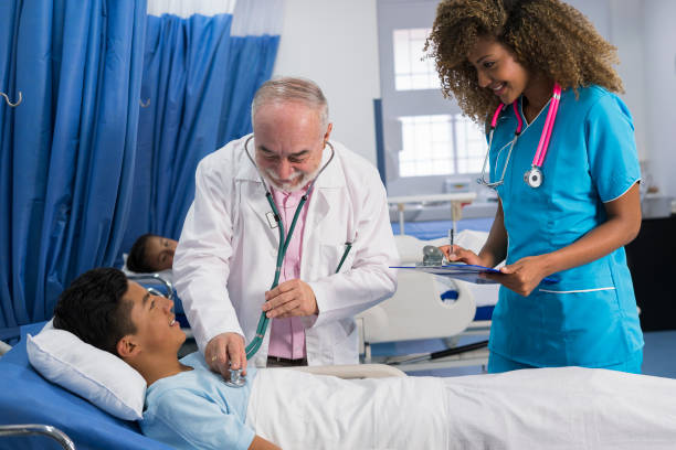 istock Doctor examining a young man 1143978278