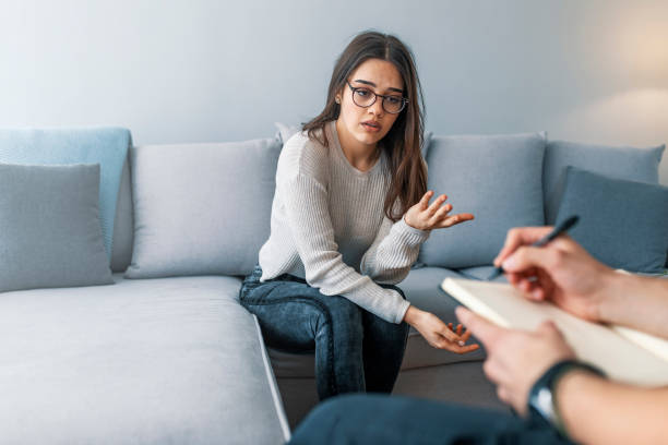 istock Woman at therapy session. 1143978398