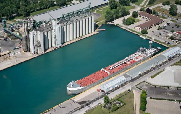 Freighter  docked by grain elevators