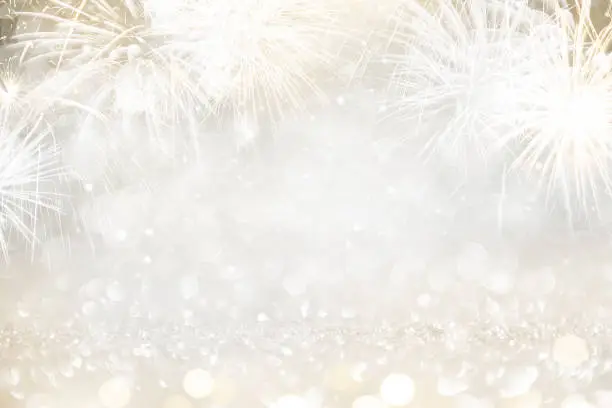 Photo of Gold and silver Fireworks and bokeh in New Year eve and copy space. Abstract background holiday.