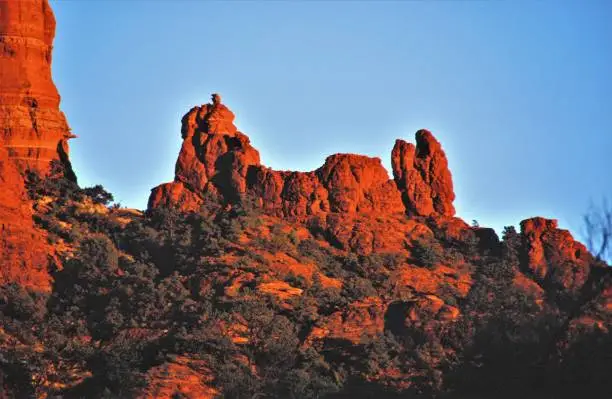 Snoopy Rock is most easily seen at sunset.  The shadows are best for seeing the abstract cartoon figure from the comics in your newspaper.  Sedona Arizona USA.
