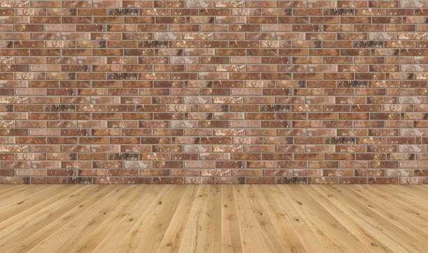 istock Empty room with brown wooden floor and old red brick wall. Empty loft room for design interior. Long wide picture of empty living space room. 1143983831