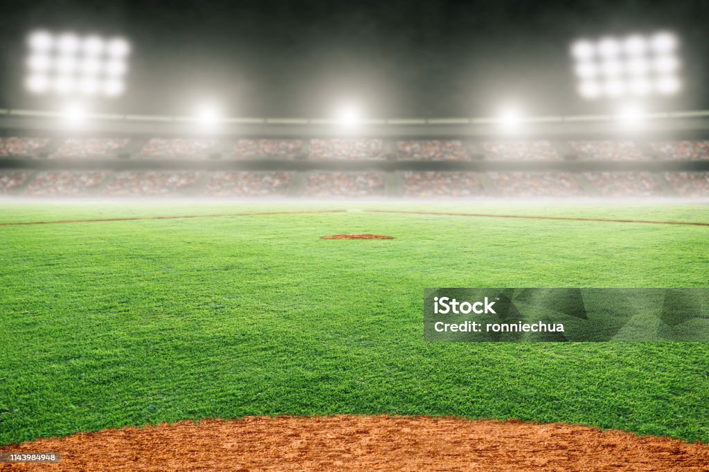 Baseball Field in Outdoor Stadium With Copy Space Baseball field at brightly lit fictitious outdoor stadium. Focus on foreground and shallow depth of field on background and copy space. Stadium created in Photoshop. Baseball - Sport Stock Photo