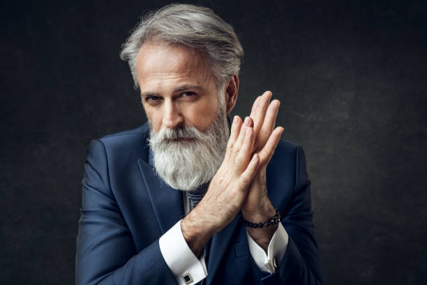 istock Dapper Gentleman having fashion photoshooting in studio 1143990388