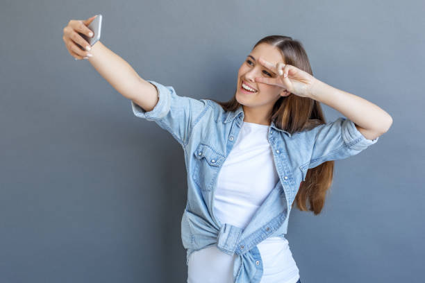 istock Young woman free style isolated on grey 1143998139